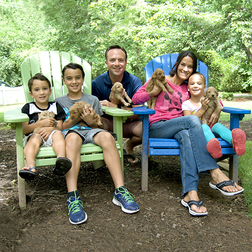 family with puppies